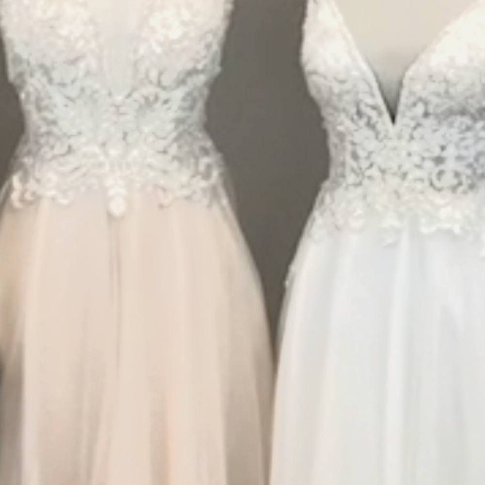 Galina wedding dress. Champagne/blush. Size 12. Plunging neckline. A line skirt
